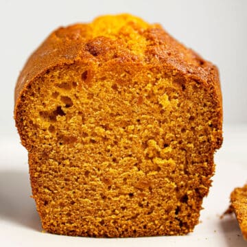 Easy Pumpkin Banana Bread Loaf With Cake Mix on White Dish.