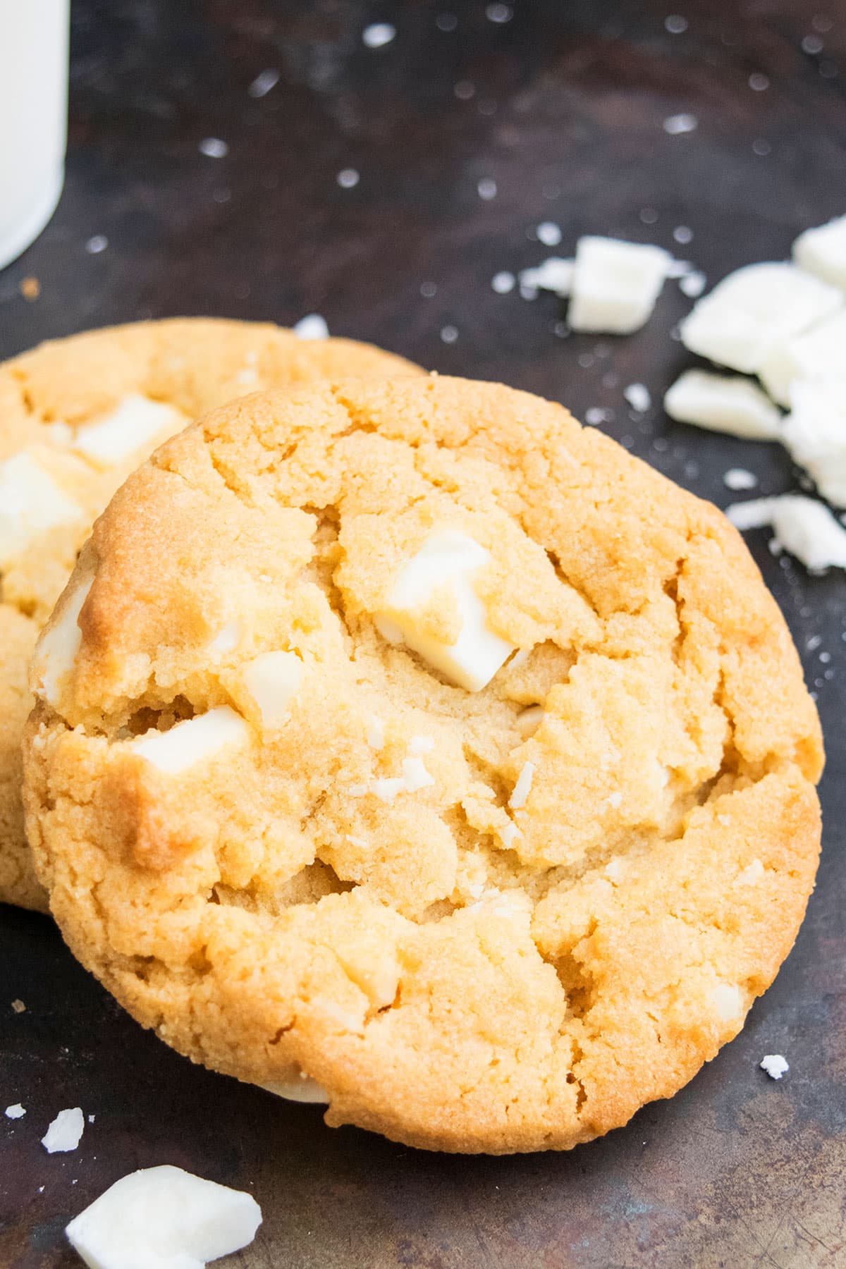 Easy White Chocolate Macadamia Nut Cookies on Rustic Black Tray.