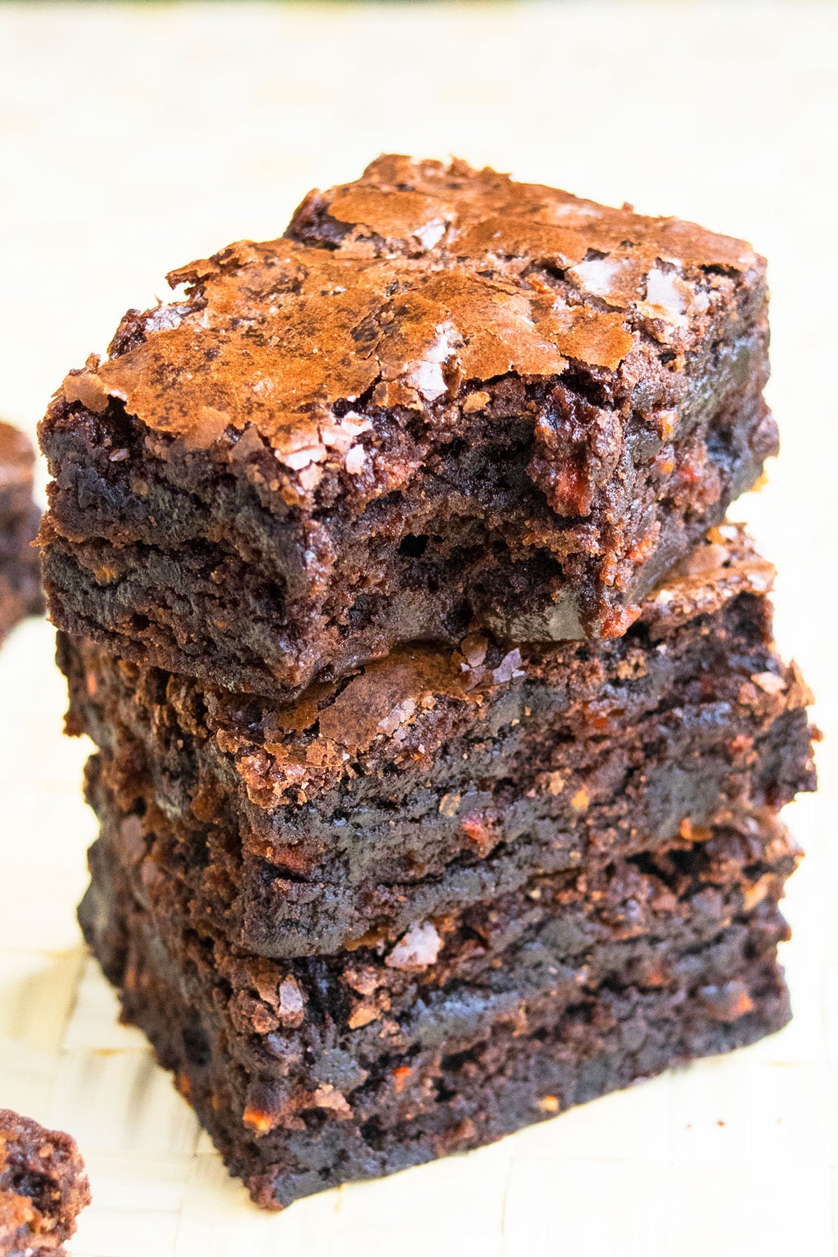 Stack of Brownies With Top One Partially Eaten. 