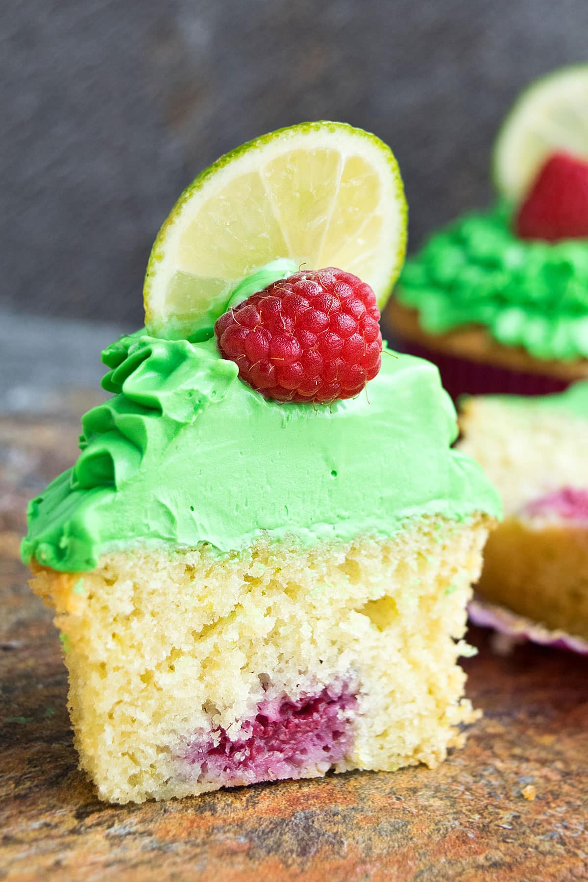 Partially Eaten Frosted Cupcake. 