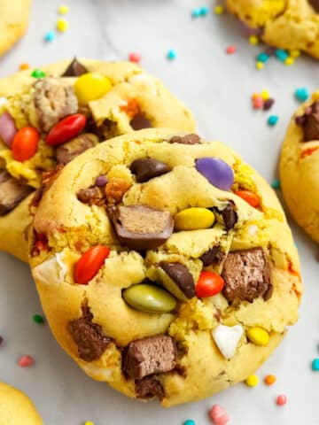 Easy Loaded Leftover Candy Cookies (Halloween) on Marble Background- Closeup Shot.