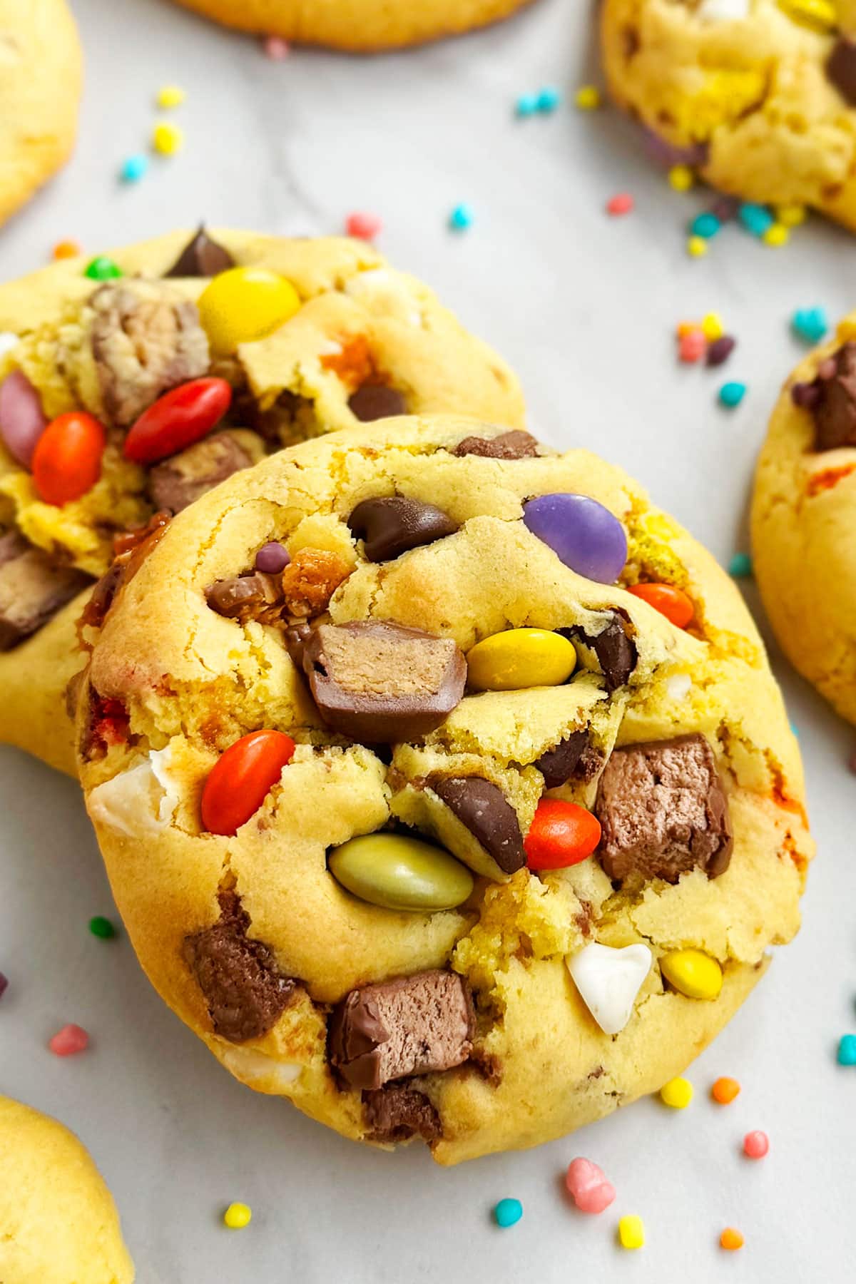 Easy Loaded Leftover Candy Cookies (Halloween) on Marble Background- Closeup Shot.