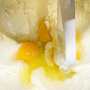 Eggs added to creamed butter and sugar mixture. 