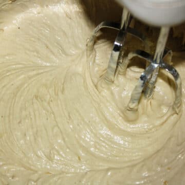 Batter being mixed with a hand mixer. 