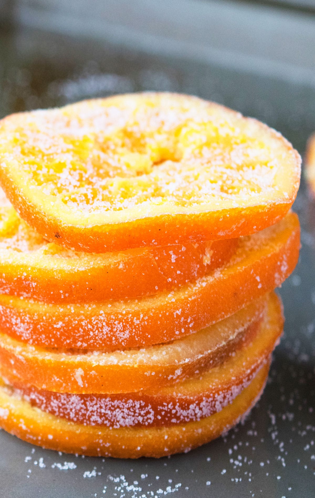 Stack of Sugared Orange Slices on Gray Tray. 