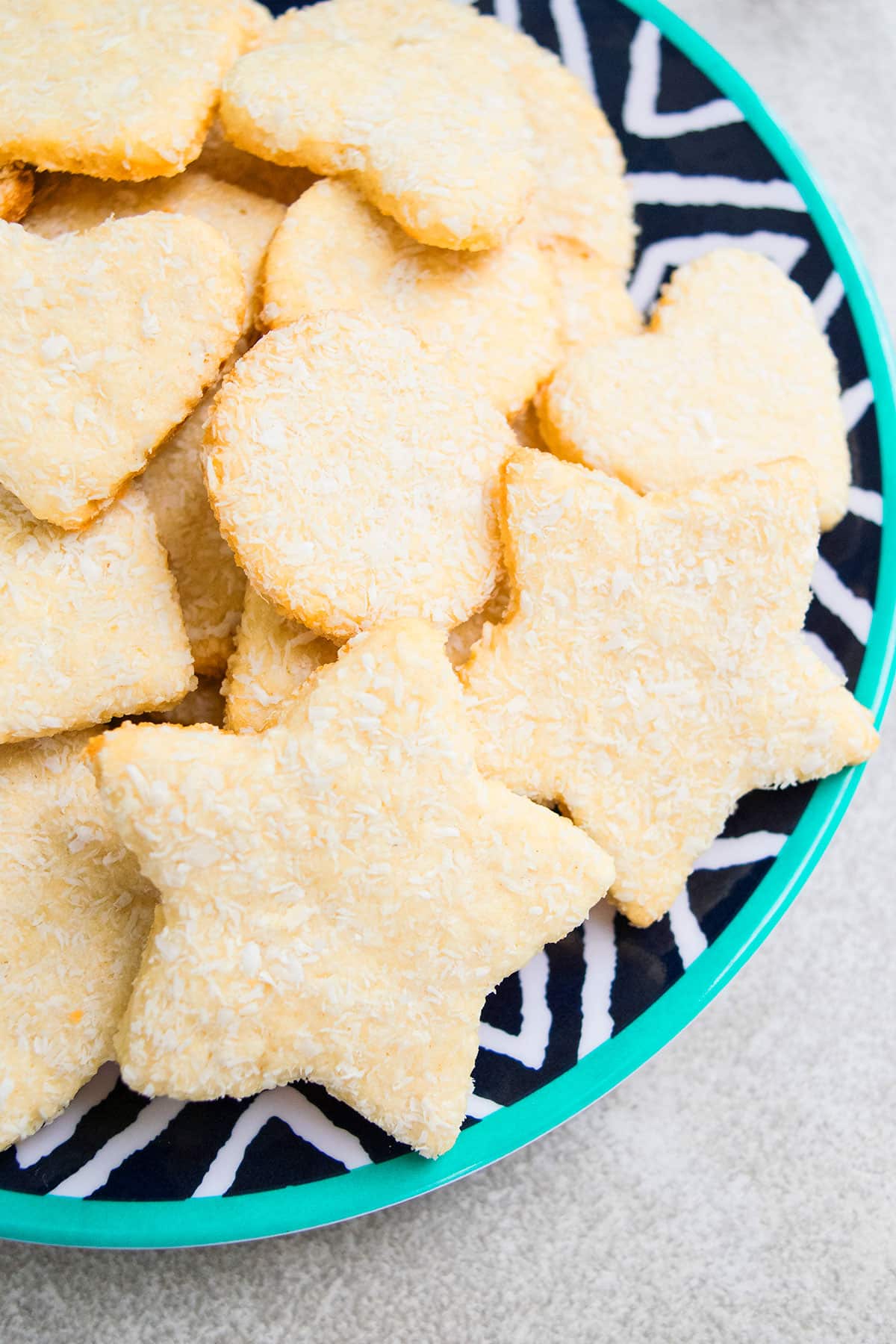 Easy Cut Out Coconut Sugar Cookies on Pattern Dish. 