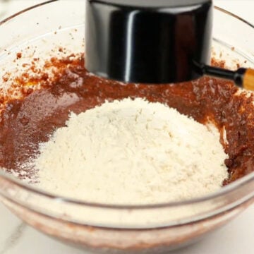 Flour being added to chocolate mixture. 