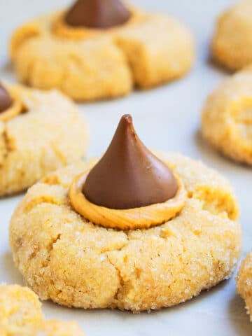 Easy Classic Peanut Butter Blossoms on White Marble Background.