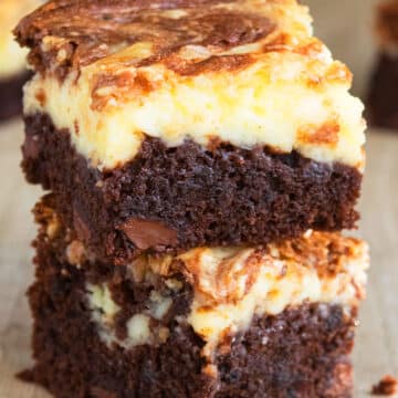 Stack of Easy Chocolate Cheesecake Brownies From Scratch on Wood Background.