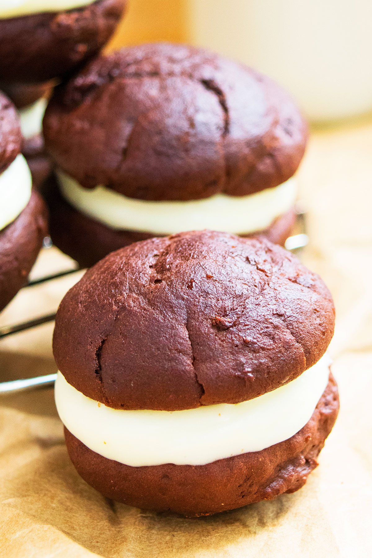 Closeup Shot of Filled Cookie Sandwich on Brown Parchment Paper. 