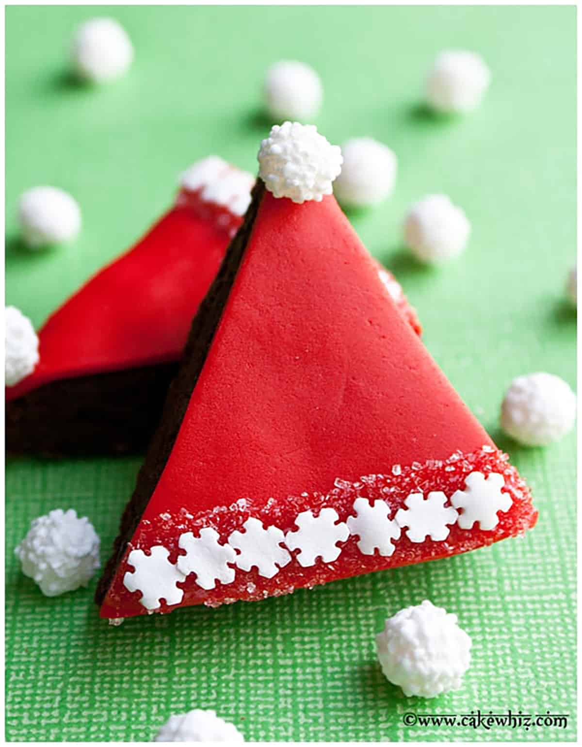 Easy Santa Brownies With Fondant on Green Background.