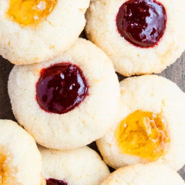 Classic Easy Jam Thumbprint Cookies on Wood Background.