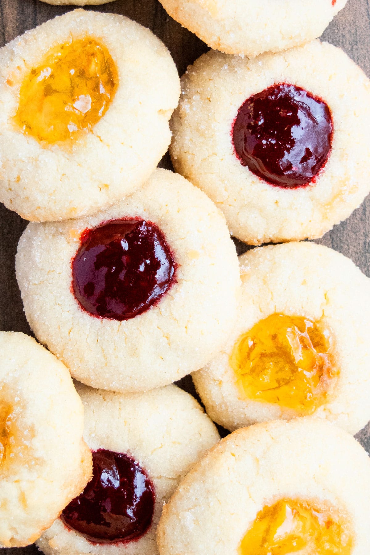 Classic Easy Jam Thumbprint Cookies on Wood Background. 