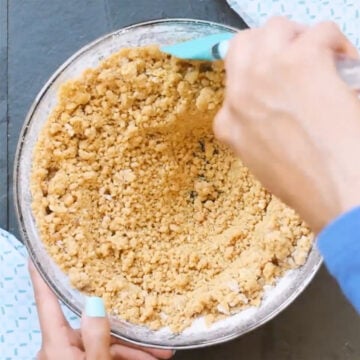 Cookie dough being mixed with spatula. 