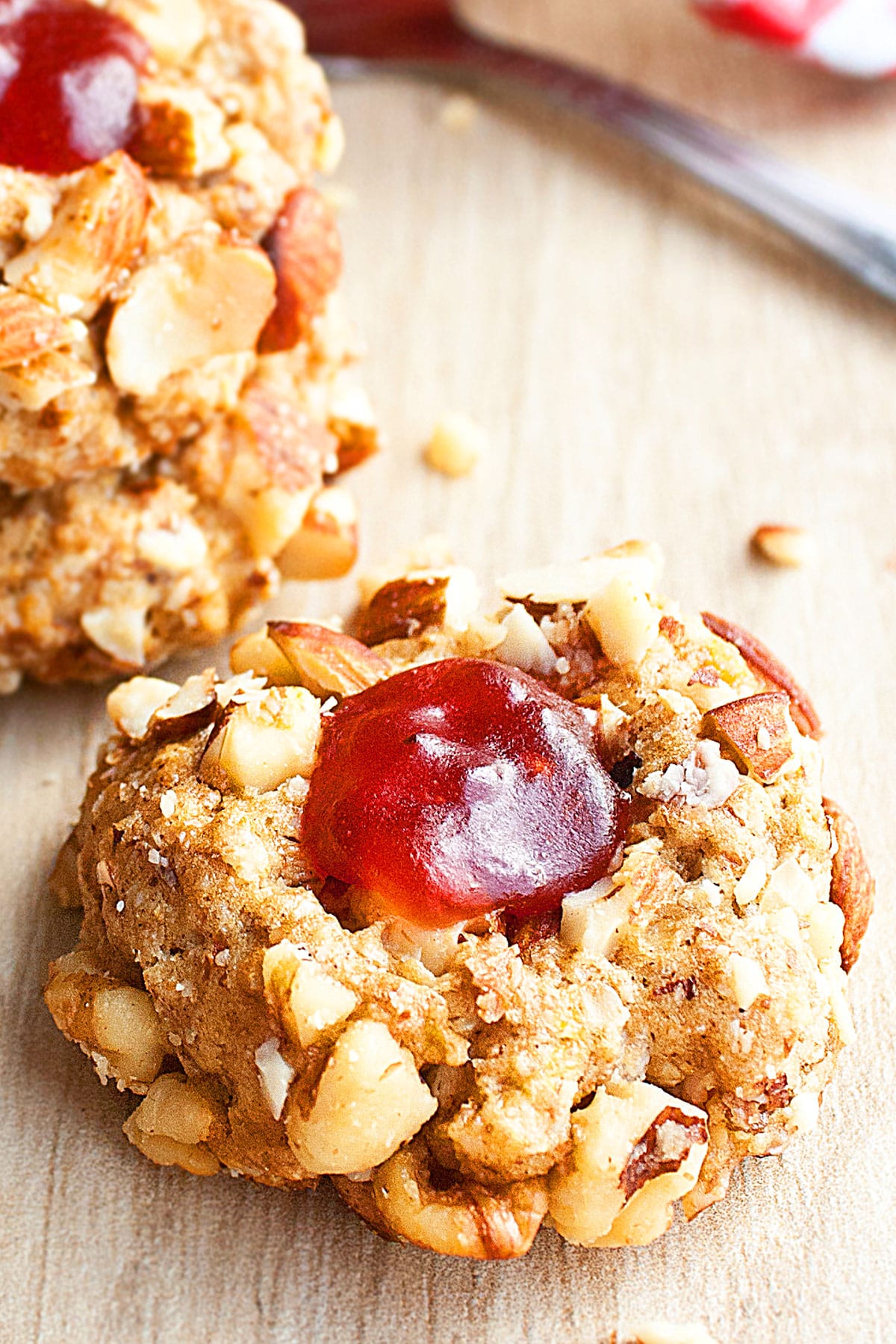 Easy Peanut Butter and Jelly Cookies (Thumbprints) on Rustic Wood Background.