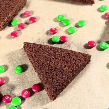 Triangle brownie slice on brown parchment paper. 