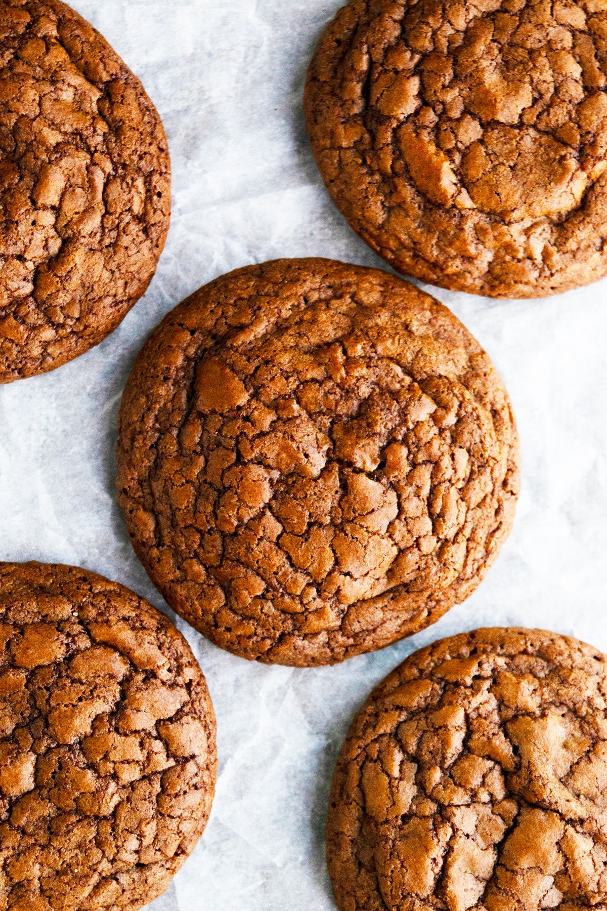 Chocolate Brownie Cookies With Brownie Mix Box on Parchment Paper- Overhead Shot. 