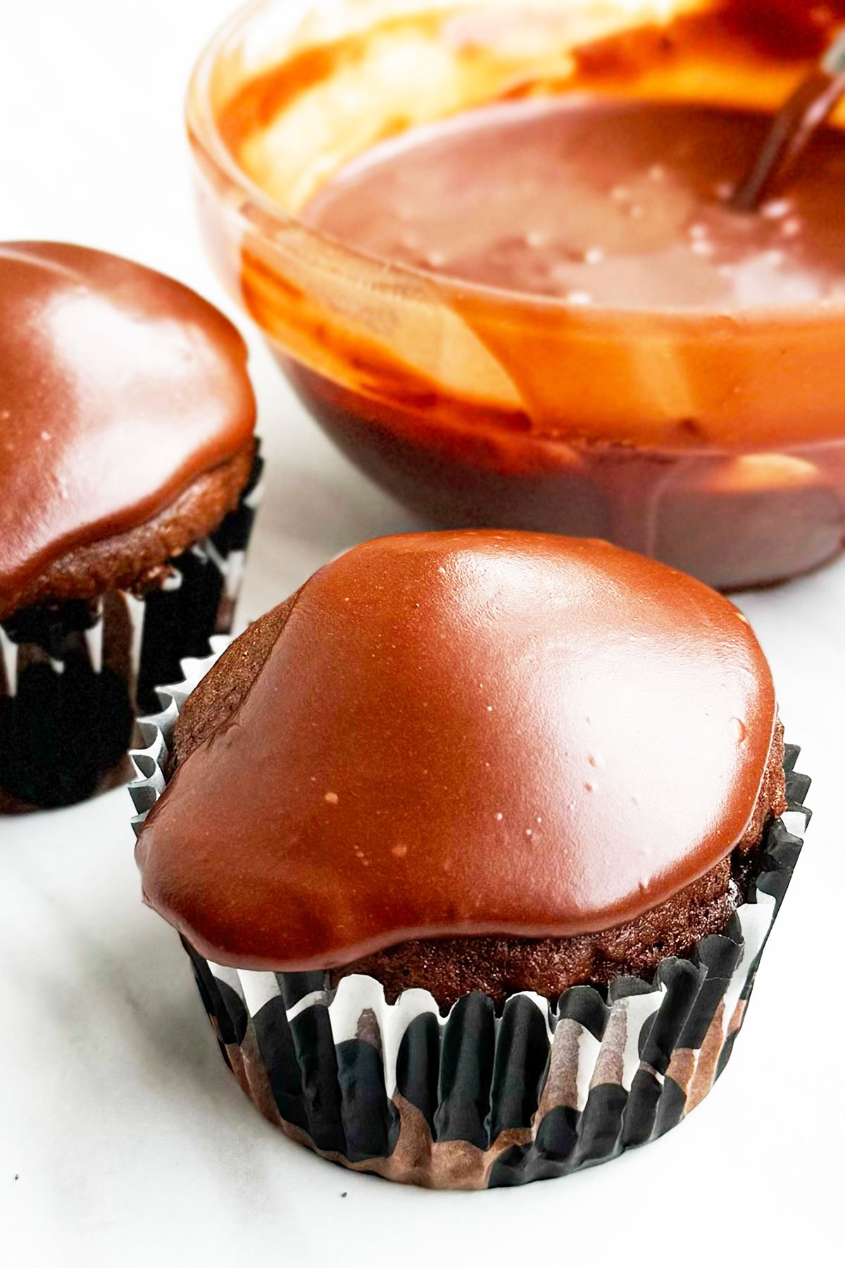 Chocolate Muffin With Chocolate Topping on Marble Background. 