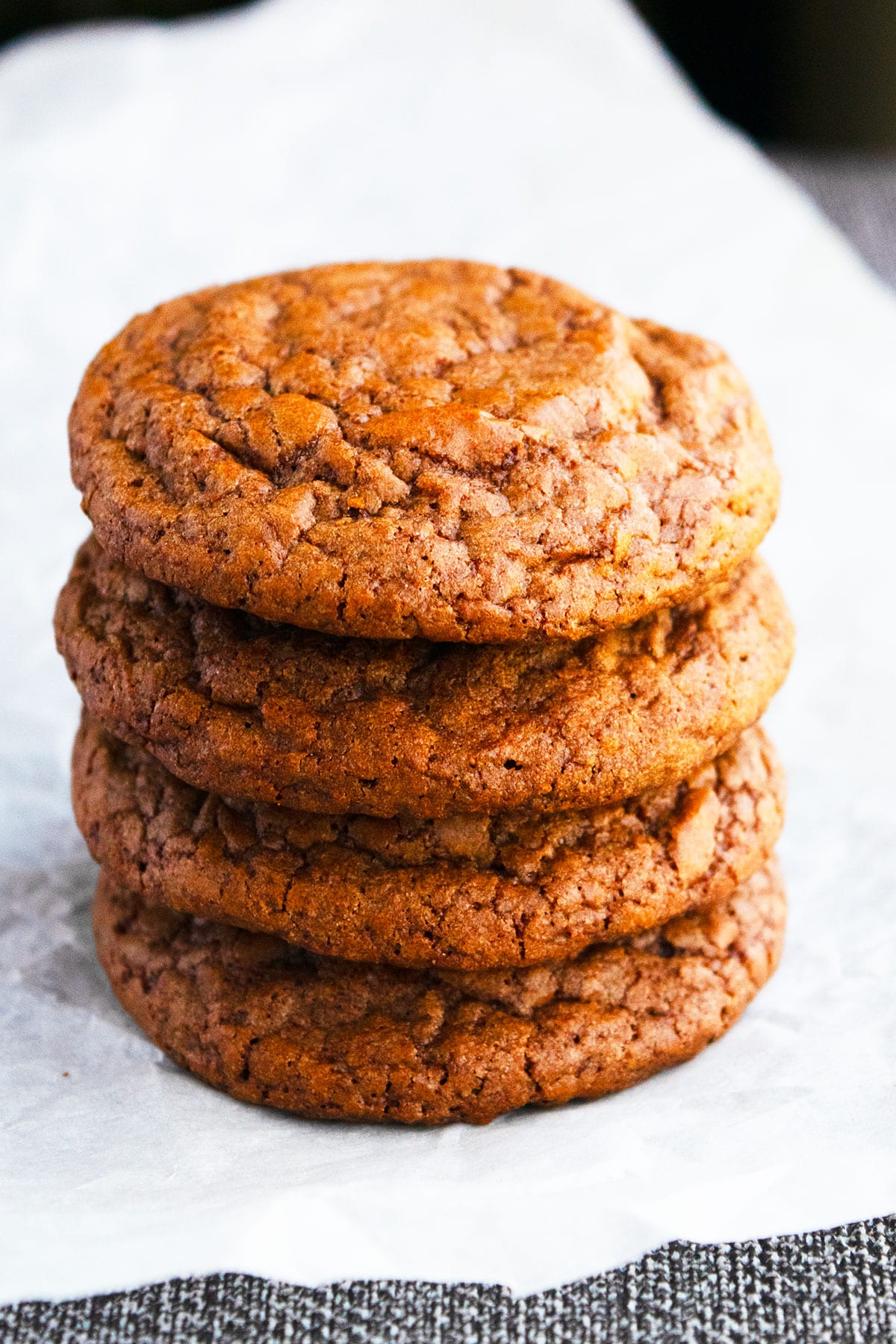 Stack of Brownie Mix Cookies on Parchment Paper.