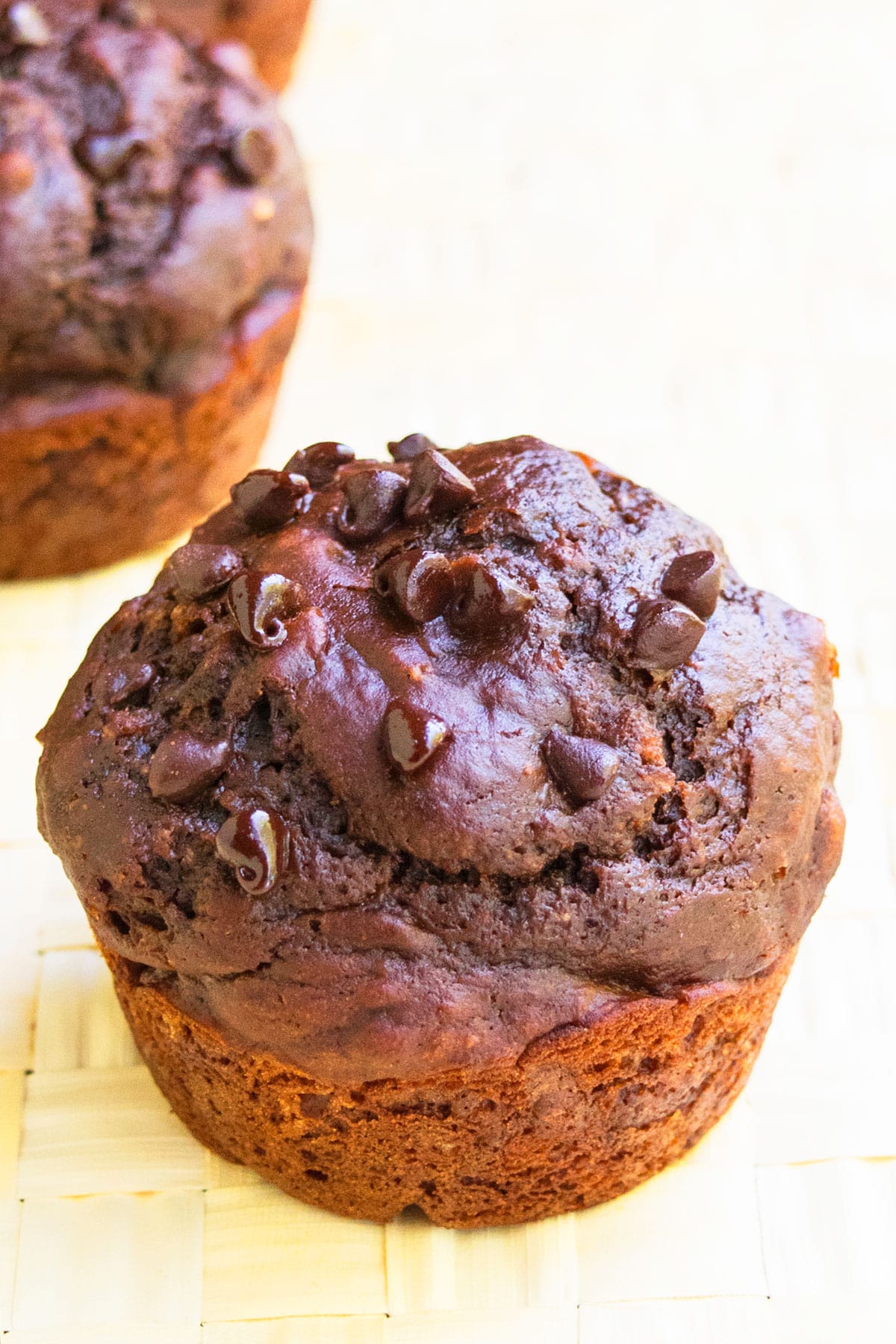 Closeup Shot of Muffin on Beige Sheet of Paper. 