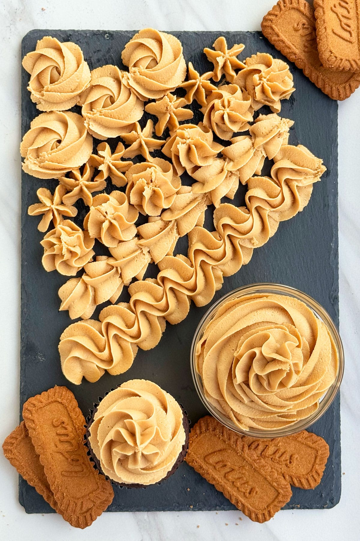 Frosting Piped in Different Ways on Black Board. 