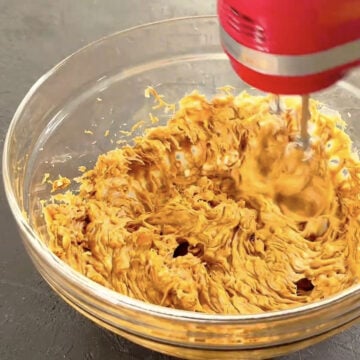 Butter and Biscoff creamed together in bowl. 