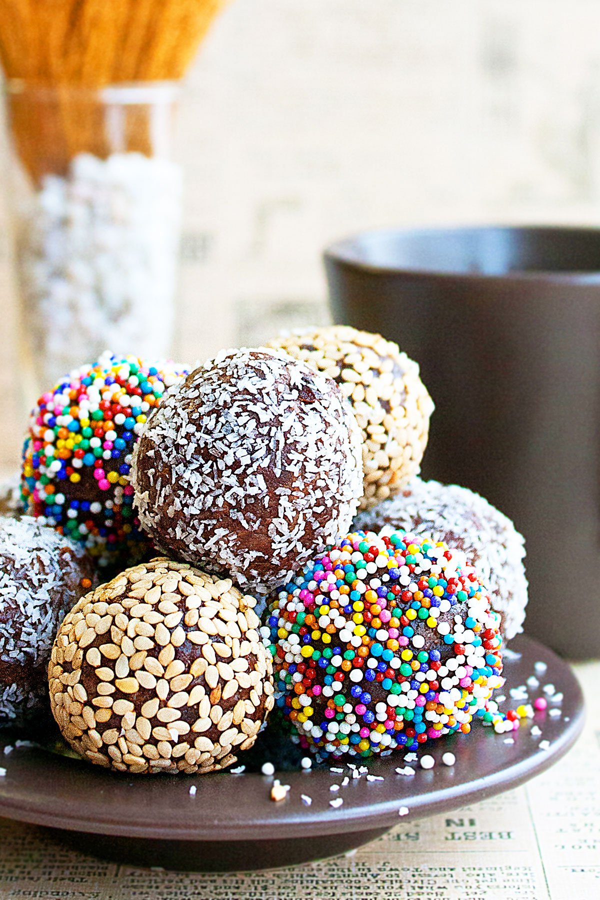 Snack Balls With Multiple Toppings on Brown Dish. 