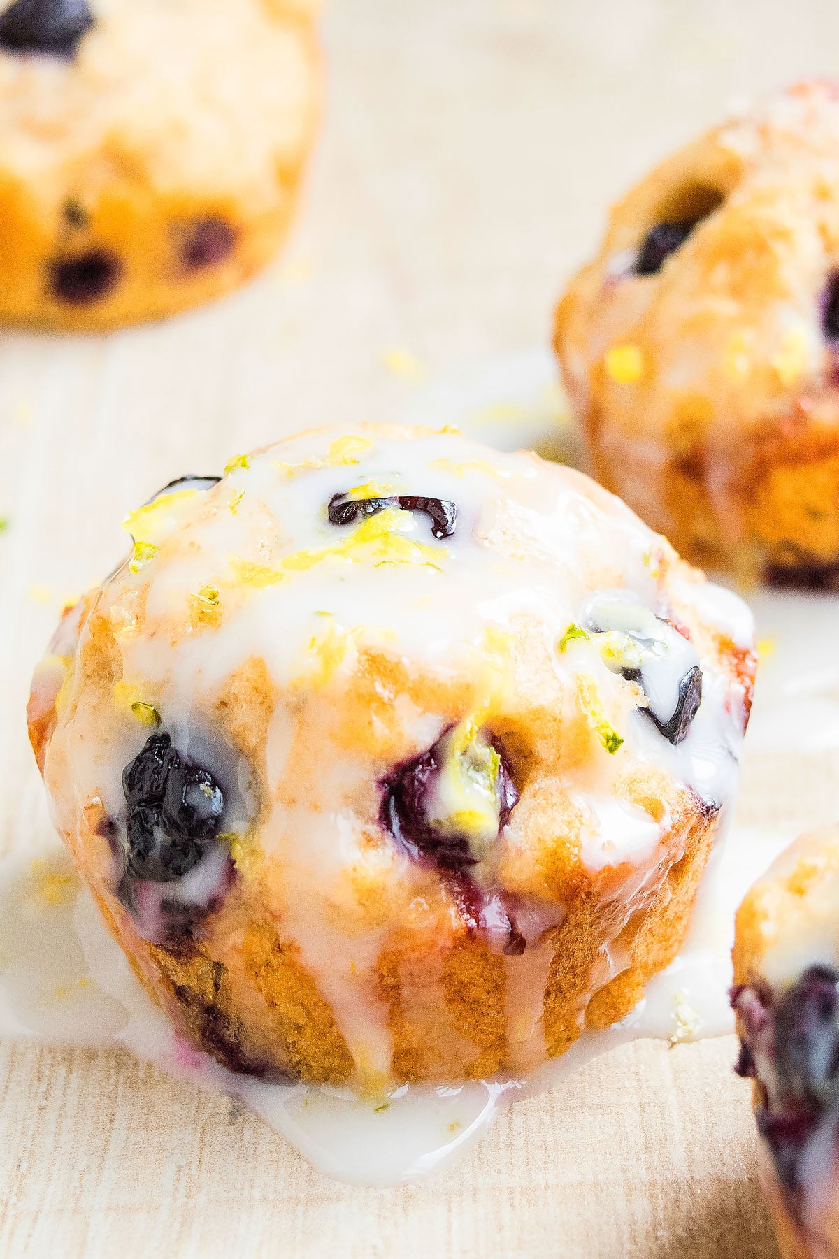 Glazed Berry Muffin on Light Brown Background. 