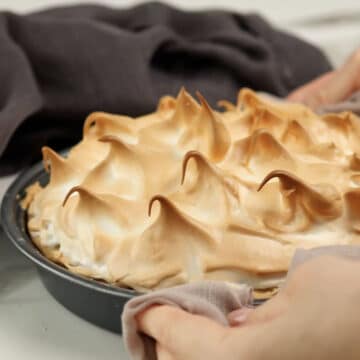 Meringue topping torched to become golden brown. 