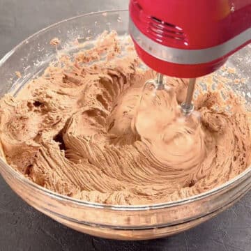 Final mixing of ingredients in glass bowl with hand mixer. 