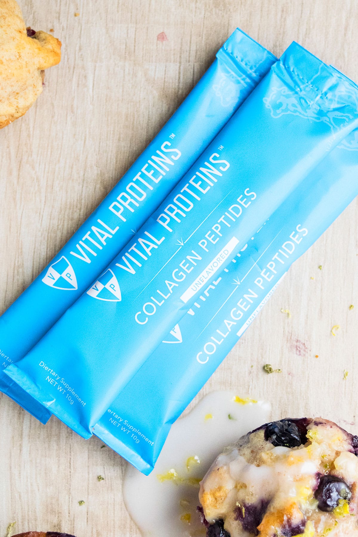 VP Collagen Peptides Packets on Light Brown Background. 