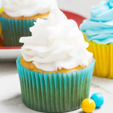 Easy 2 Ingredient White Chocolate Buttercream Frosting Swirled on Top of Cupcake.