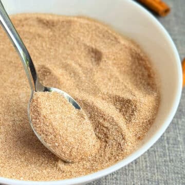 Spoonful of combined ingredients in white bowl. 