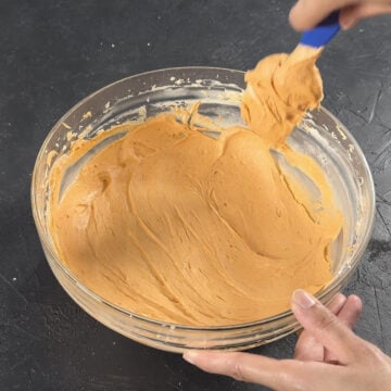 Icing in bowl made smooth with spatula.  