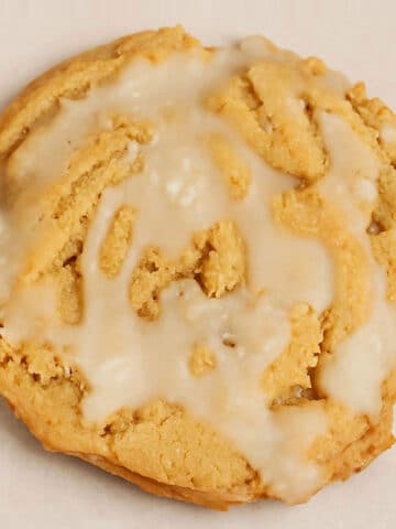 Easy Soft and Chewy Glazed Brown Sugar Maple Cookies on Beige Background- Closeup Shot.