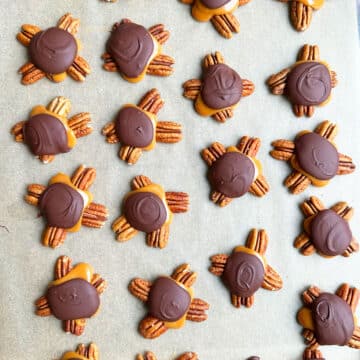 Pecan clusters with chocolate and caramel that has set.   