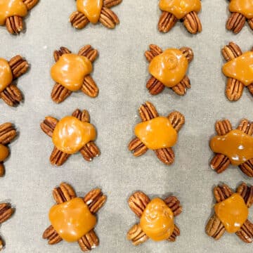 Pecan clusters topped with melted caramel. 