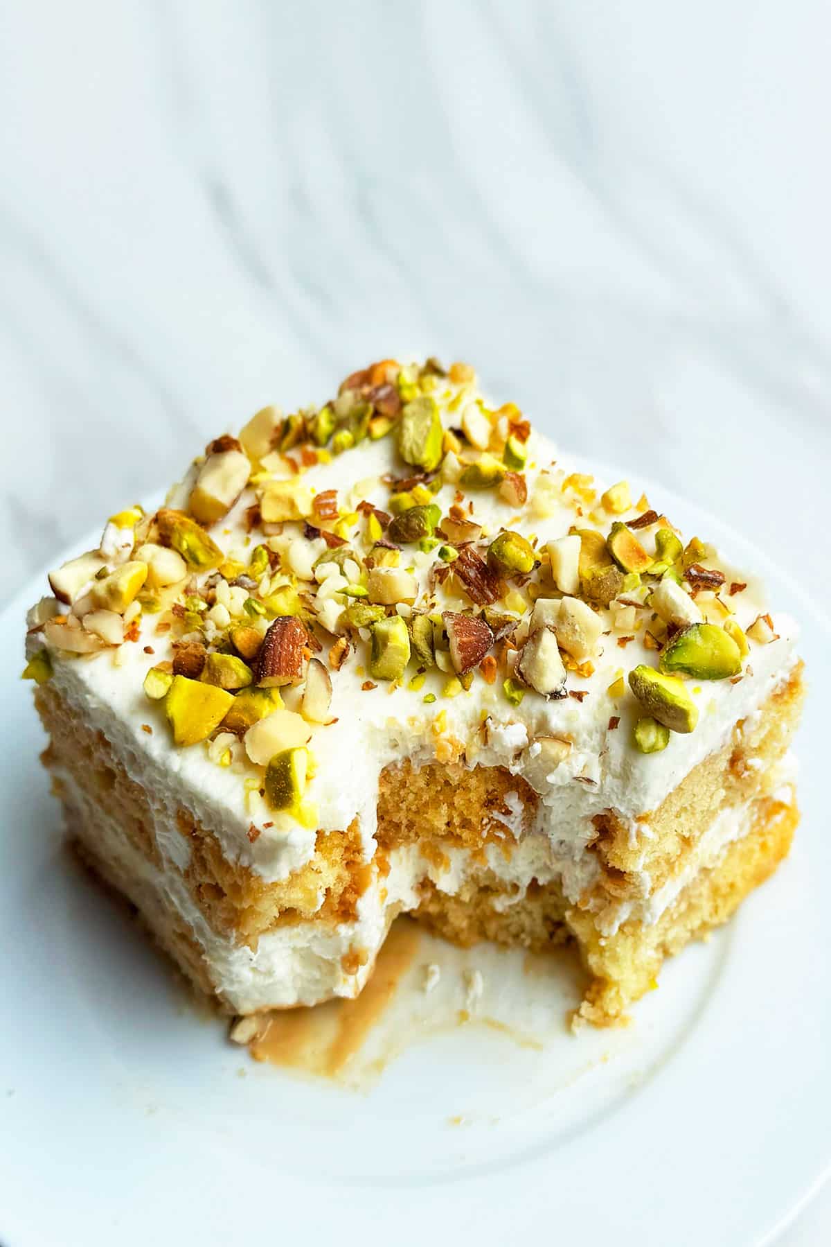 Partially Eaten Cake Slice on White Dish. 