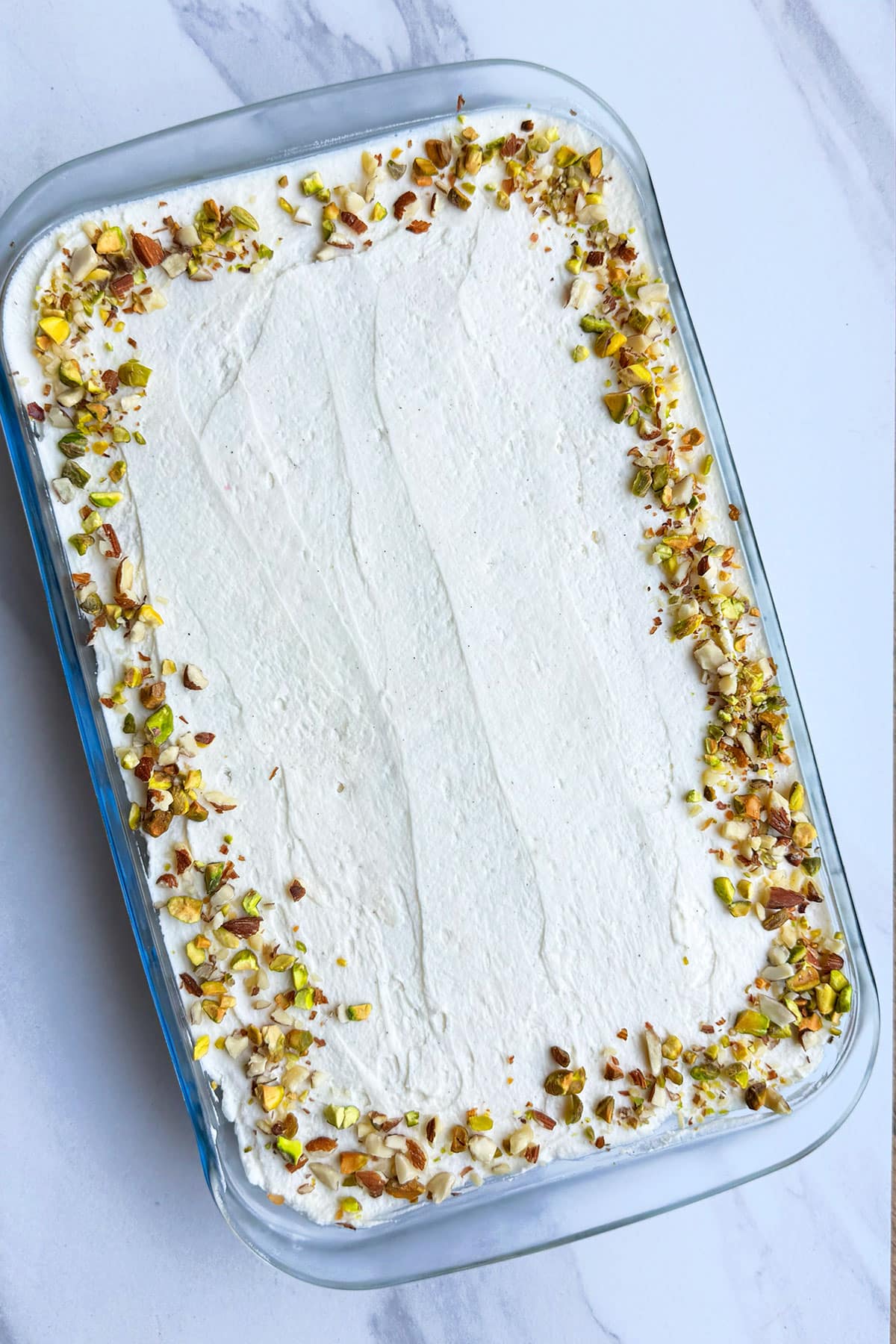 Indian No Bake Chai Cake on White Marble Background. 