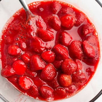 Glass Bowl of Macerated Strawberries- Overhead Shot.