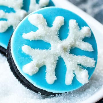 Easy Snowflake Cookies (Snowflake Oreos) on White Dish.