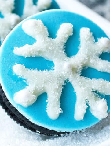 Easy Snowflake Cookies (Snowflake Oreos) on White Dish.