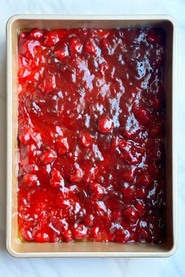 Strawberry pie filling in rectangle pan. 