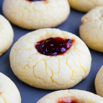 Easy Lemon Raspberry Cookies (Thumbprint) Made With Cake Mix on Baking Tray- Closeup Shot.
