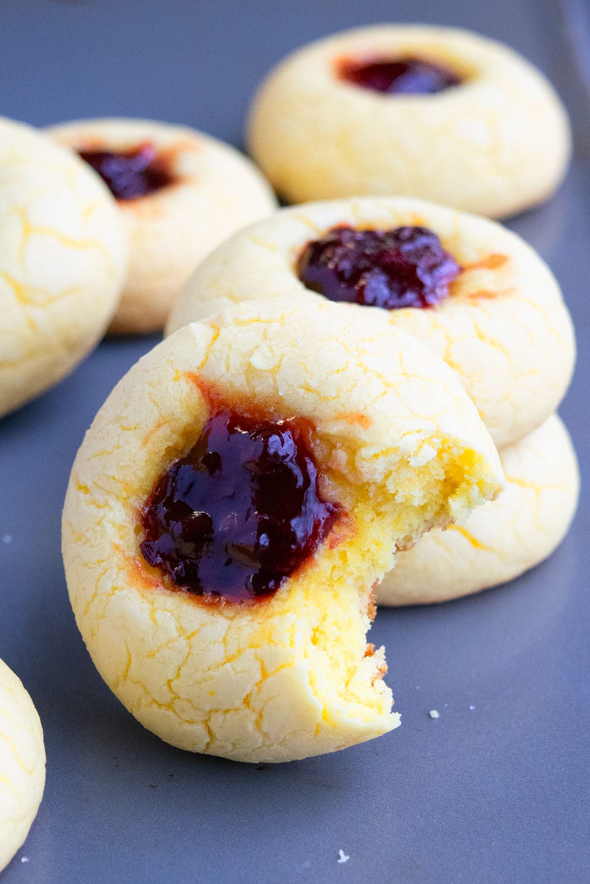 Partially eaten cookie on baking tray. 