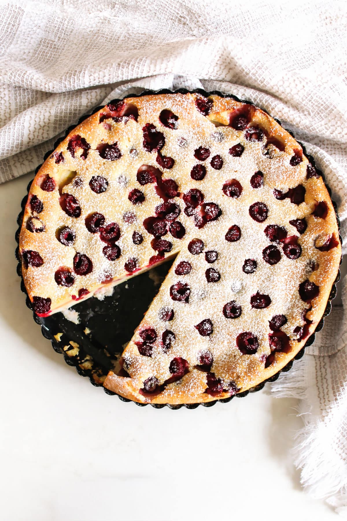 French fruit dessert with one slice removed- Overhead shot. 