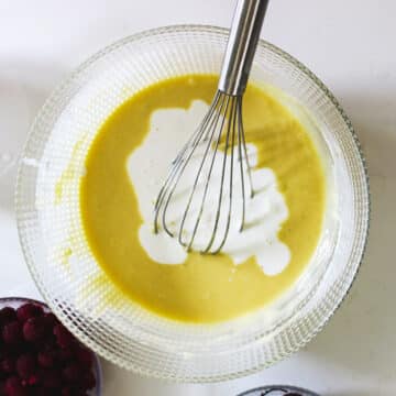 Batter being whisked together in glass bowl. 